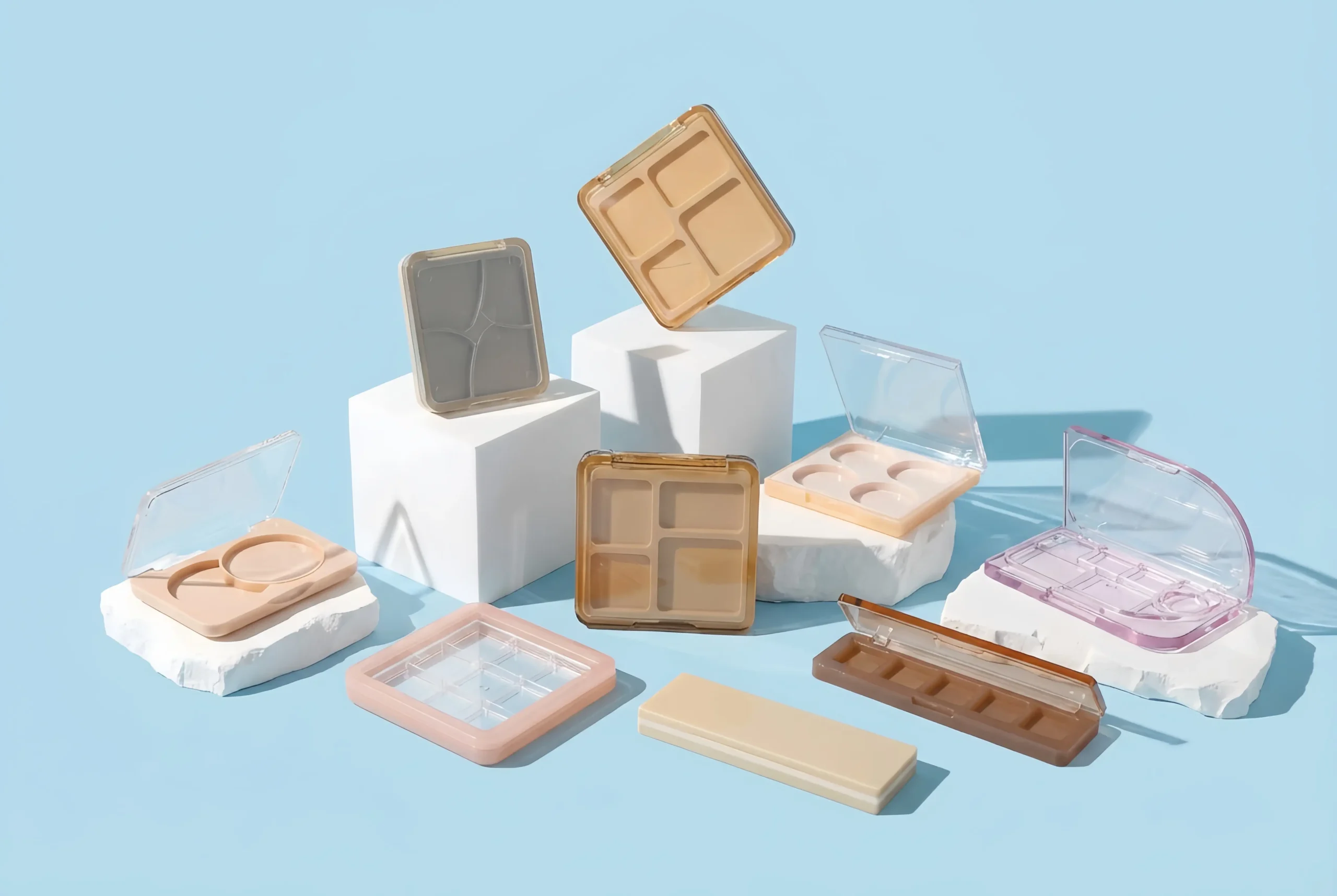 Collection of square and rectangular empty cosmetic palettes with clear lids, featuring 4-pan and 9-pan layouts, manufactured by China factory.
